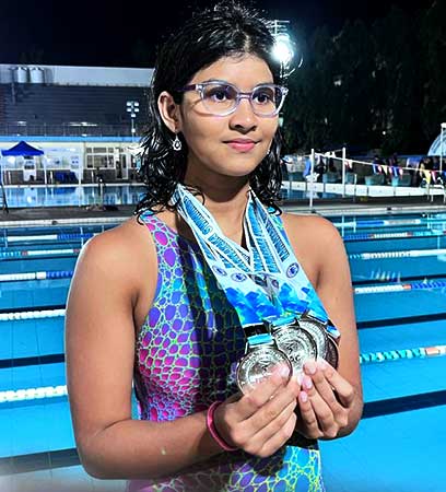 JHS student Dhanya Nataraj Naik won 4 medals at the Karnataka Swimming Association